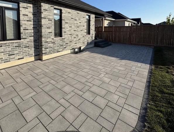 Backyard interlock patio near a house in Oakville, Ontario