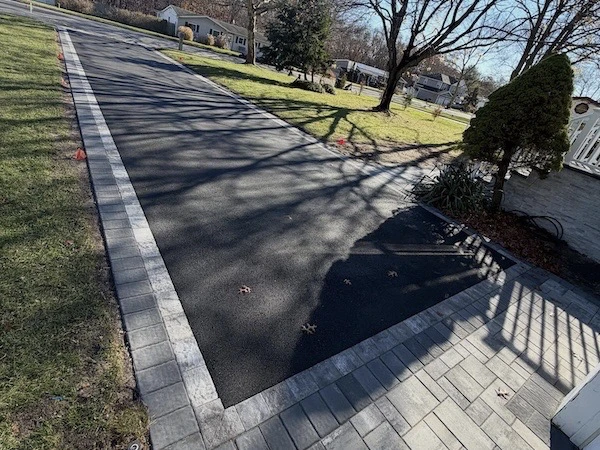 Driveway change/resurface of asphalt and extra border made from interlock stone in King City, Ontario