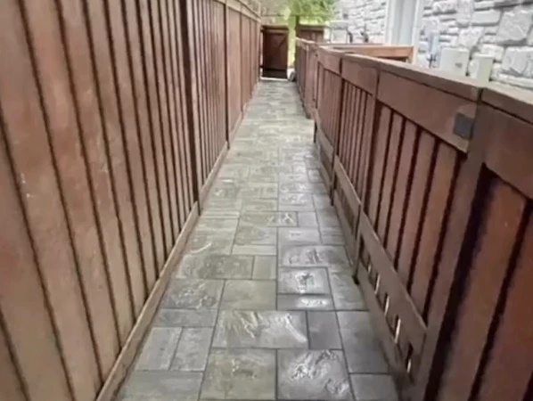 Interlock walkway along fence in Vaughan, Ontario