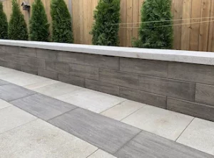 Retaining wall in the backyard with fence